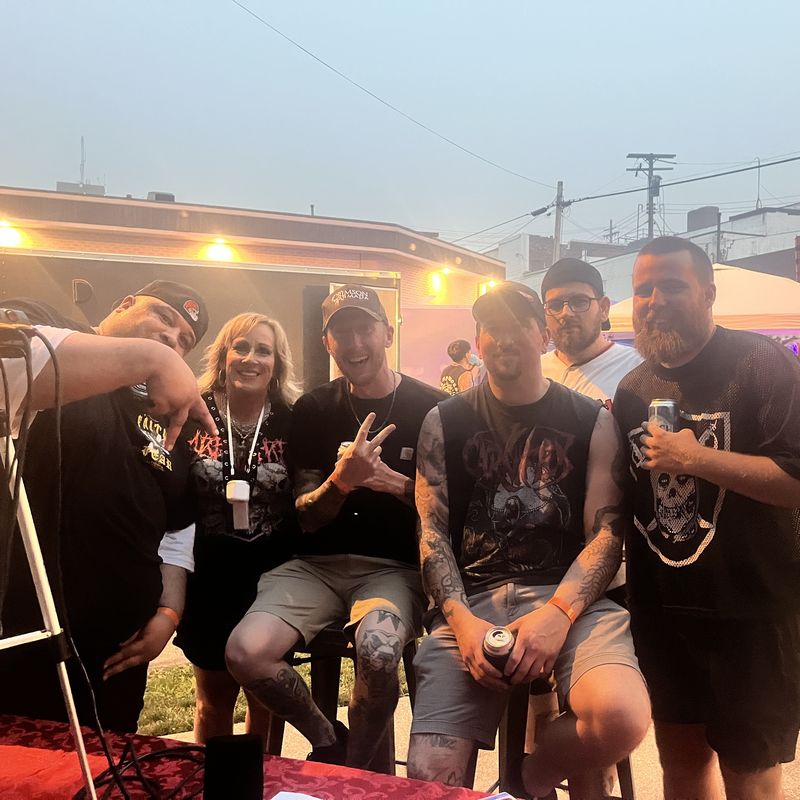 Rasan with the band Aimpoint at the Pre-Ink Festival
